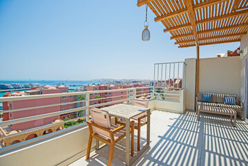Roof patio terrace with chairs in tropical luxury apartment resort