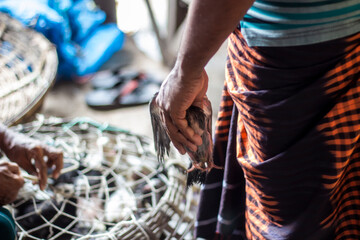 A man shows his hand and five fingers