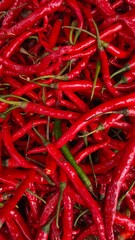 A close-up of fresh red and green chili peppers. Perfect for spicy food themes, ingredients,...