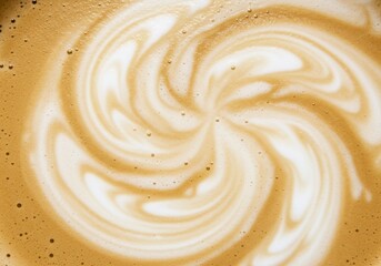 Closeup of latte art with a swirling pattern