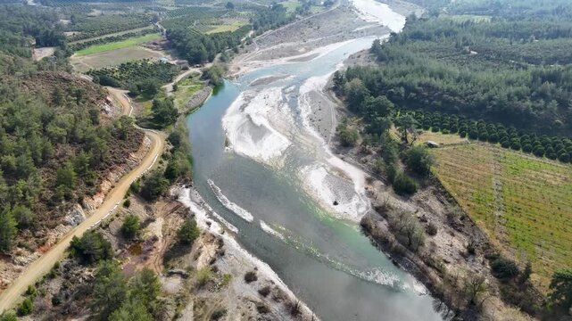 Aerial view of Nam Nam stream winding through forested mountains in Mugla, Mediterranean Turkey.