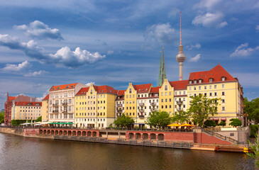 Naklejka premium View of Nikolaiviertel district with the Berlin TV Tower and historic buildings along the Spree River in Berlin Germany