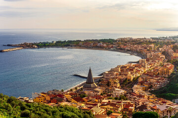 scenic view of old town on a coast line near blue sea gulf. Sunset evening landscape of coastline...