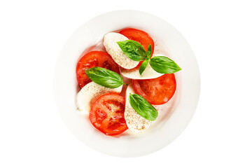 Caprese salad mozzarella and tomato, basil fresh delicious gourmet food background on the table...