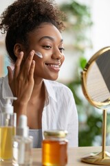 Woman applying face cream for skincare routine and beauty treatment at home in mirror