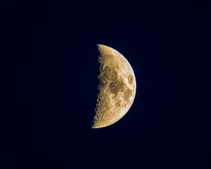 First Quarter Moon: Detailed Lunar Surface with Craters & Terminator in Dark Space – Astronomy Night Sky Stock Photo