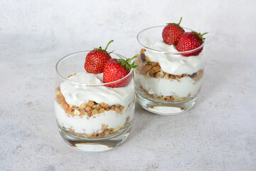 Yogurt Parfaits with Strawberries in Glasses isolated on gray