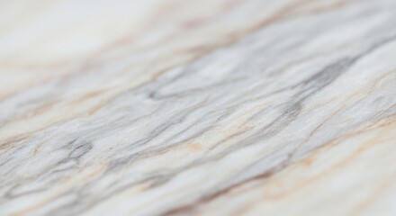 Elegant white marble texture with soft, flowing grey and beige veins, shown in a detailed close-up with a shallow focus.