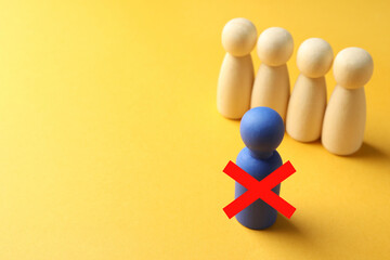 Dismissal. One blue human figure with red cross among others on orange background