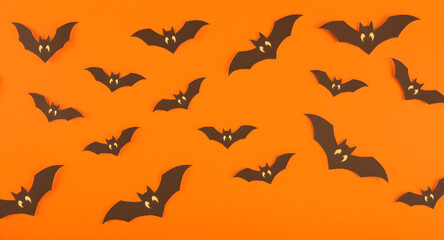 Create Fun and Festive Halloween Decorations with Paper Bats on Orange Background