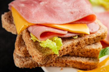 Sandwich ham, cheese, bread toast meat spam fresh delicious gourmet food background on the table rustic food top view copy space