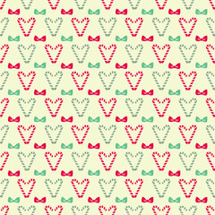 A delightful seamless pattern featuring alternating rows of candy cane hearts in red and mint green, adorned with matching bows