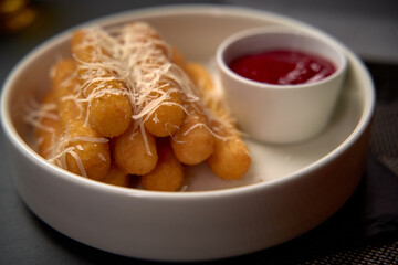 Delicious and Crispy Cheese Sticks Served with Tangy Marinara Sauce for a Perfect Snack or Appetizer Experience