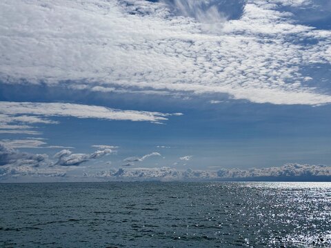 Sparkling sea and amazing sky clouds.