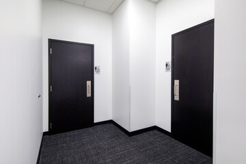 men and woman's bathroom doors in office space