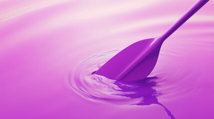 a purple paddle disturbing a reflective liquid surface creating circular ripples