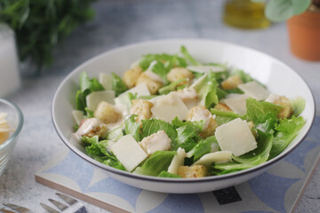 A bowl with classic Caesar salad