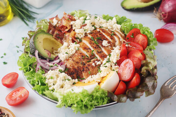 A bowl with cobb salad, traditional American dish	