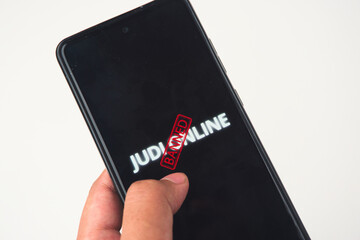 Smartphone Displaying Banned Notification on Online Gambling Content in Bright Setting