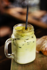 Refreshing iced matcha latte with delicious croissant. Perfect for a relaxing break.