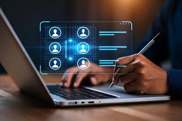 Person using laptop with digital interface showing user profiles