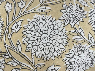 Fabric with a delicate floral pattern, close-up as texture. Old-fashioned cotton or linen textile...