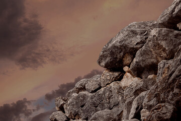 Close up of a rocky mountain and sunset