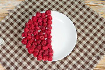 Fresh Raspberries on Checkered Tablecloth