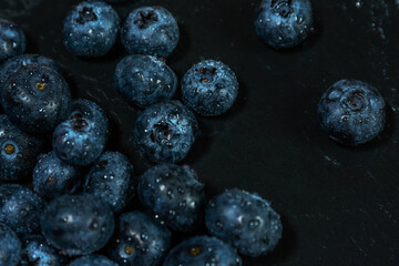 Fresh Blueberries with Water Droplets on Dark Background