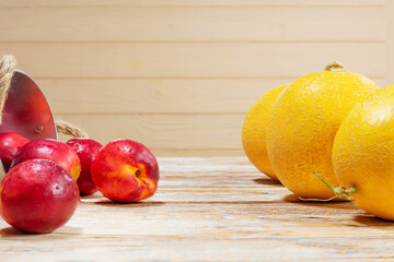 Juicy Nectarines and Melons on Rustic Wooden Table