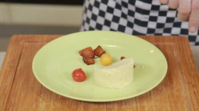 Serving cuscus with grilled vegetables garnish on a plate