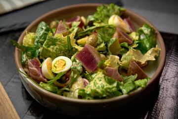 A Colorful and Nutrient-Packed Mixed Salad with Fresh Greens, Tender Meat, and a Variety of Flavorful Toppings for a Healthy Meal Experience