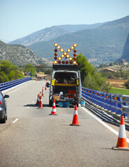 Portable traffic light installed on the side of the road for repair work