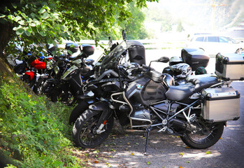Barcelona, Spain - July 10, 2024: Parked motorcycles on the side of the road