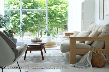 Coffee table, sofa and decor in dining room. Interior design