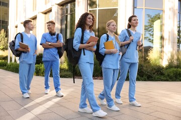 Fototapeta premium Group of medical students in uniforms near building outdoors