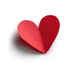 Fototapeta premium A small, red heart shape e.g., made of paper, isolated on a pure white background. Love, care, emotion.