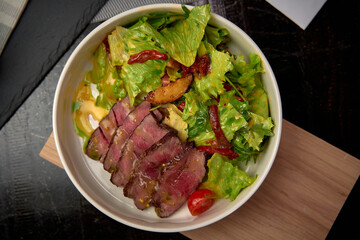Deliciously Crafted Salad with Tender Slices of Beef, Crisp Greens, and Flavorful Vegetables for a Satisfying Meal Experience