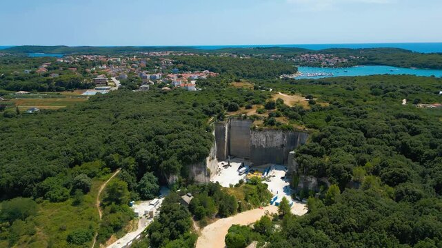 Ancient Roman quarry Cave Romane near Pula, Croatia &ndash; historic stone site surrounded by forest, dramatic rock formations