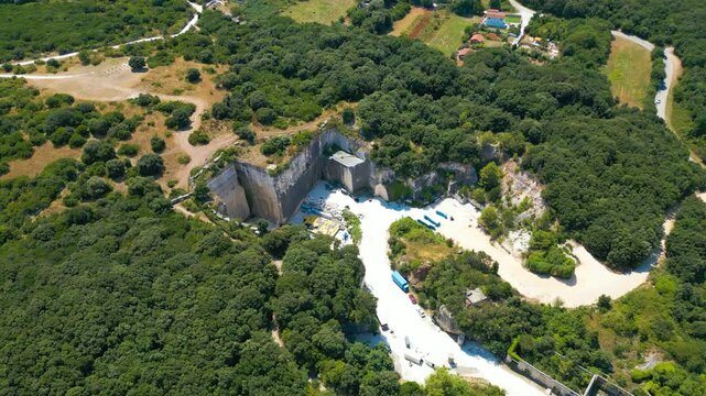 Ancient Roman quarry Cave Romane near Pula, Croatia &ndash; historic stone site surrounded by forest, dramatic rock formations