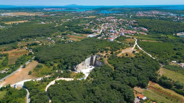 Ancient Roman quarry Cave Romane near Pula, Croatia &ndash; historic stone site surrounded by forest, dramatic rock formations