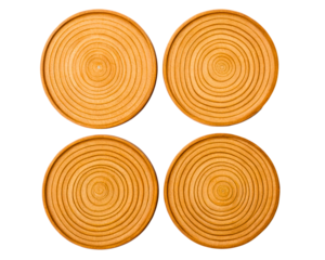 Set of four wooden drink coasters with a tree ring groove pattern on a transparent background