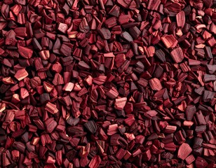 Close-up of small, crimson-colored pieces