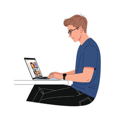 Young man wearing glasses, typing on a laptop computer while seated at a table.