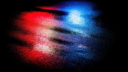 Dramatic blue and red light reflections on wet pavement in an atmospheric urban night scene.
