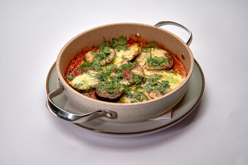 Deliciously Baked Vegetable Dish Featuring Eggplant, Tomatoes, and Herbs, Perfectly Garnished for a Flavorful Culinary Experience
