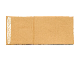 A piece of cardboard with a textured striped pattern, kraft paper for wrapping on a white background. The edges of the cardboard are torn and wavy brown. Top view of recycled cardboard texture.