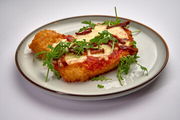 A Deliciously Crispy Dish Featuring Melted Cheese, Savory Toppings, and Fresh Greens, Perfectly...