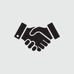 Black and white icon of two hands shaking in agreement or partnership