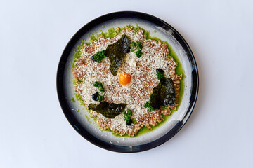 A Culinary Delight of Fresh Ingredients Featuring Savory Toppings on a Decorative Plate with a...